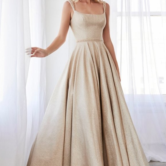 Ball gown with glitter finish and beaded belt.